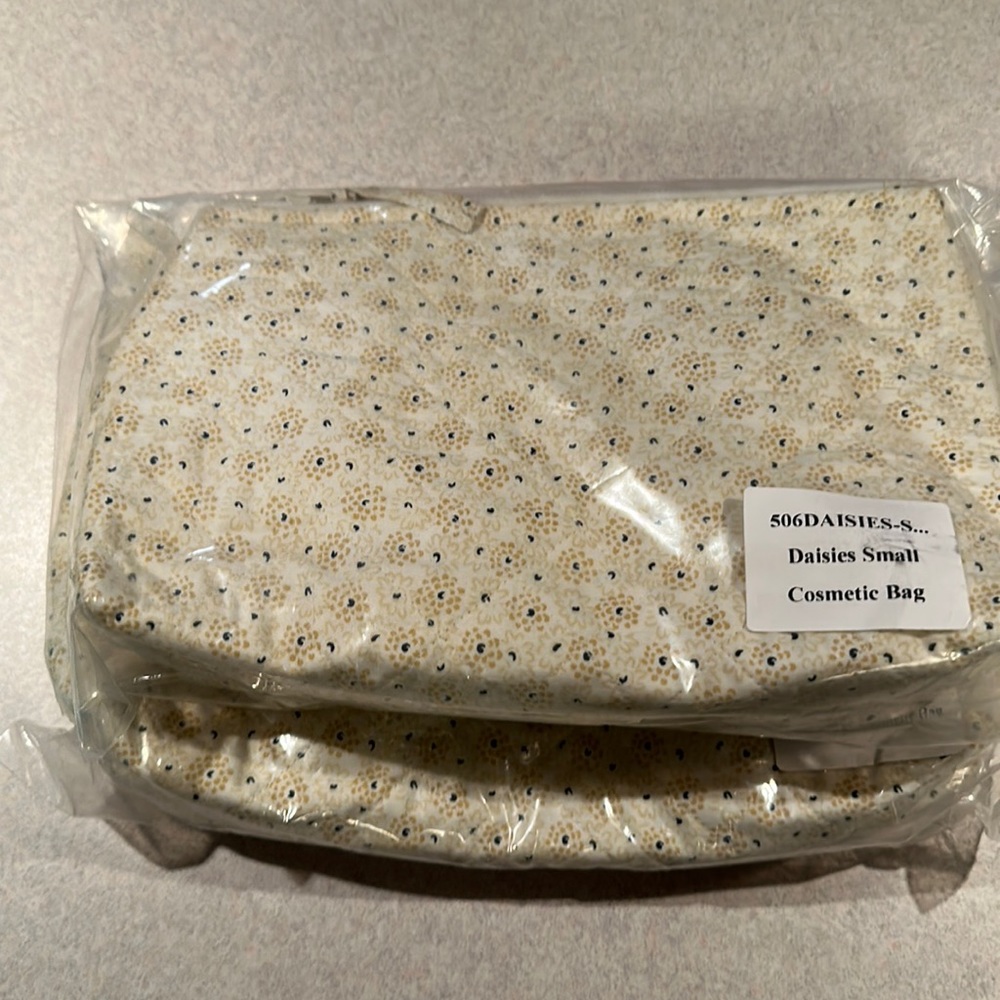 Fabric makeup bags with daisy design.